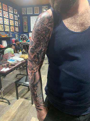 Work by Gold Cobra Tattoo