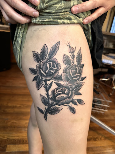 Work by American classic tattoo and body piercings