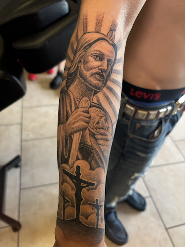 Work by El Barrio Tattoo Studio