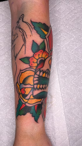 Work by American Outlaw Tattoo