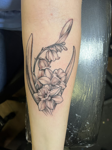 Work by Transcendent Tattoo Collective