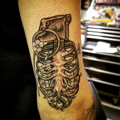 Work by Aacross The Skin Tattoo Shop