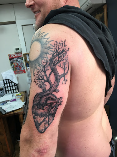 Work by Man's Ruin Tattoo & Piercing