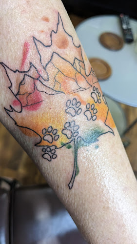 Work by Buttons Art Tattoo Studio