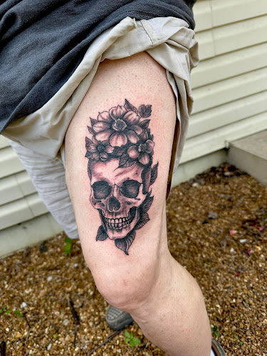 Work by Repentless Tattoo and Piercing