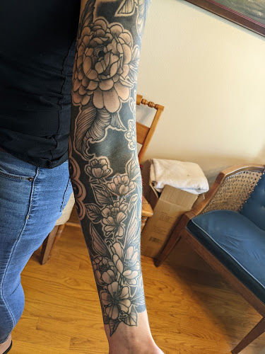 Work by Old School Tattoo and Piercing