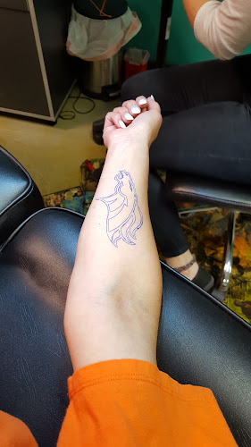 Work by Arch Rivals Tattoo