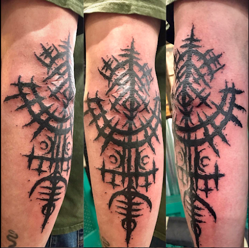 Work by Sacred Apple Tattoo