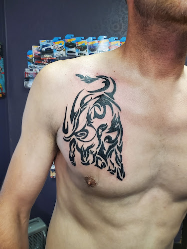 Work by Edge Of The World Tattoo Shop