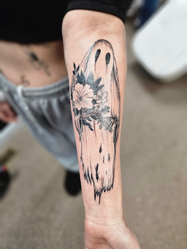 Work by Tucci’s Tattoo & Piercings Studio/Skate shop