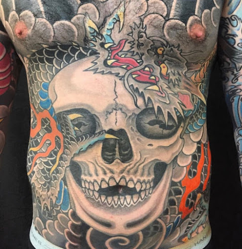 Work by Magic Cobra Tattoo Society