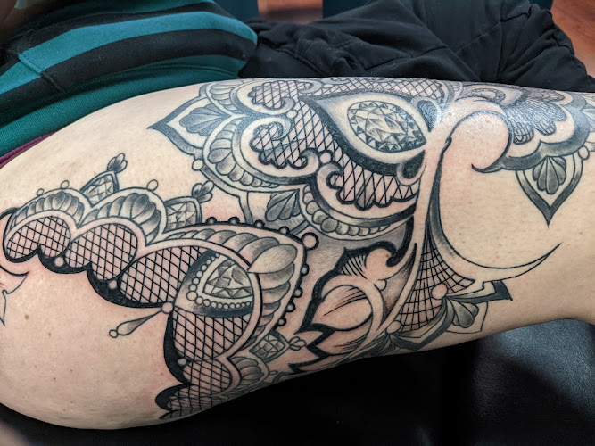 Work by Big Easy Tattoo and Piercing