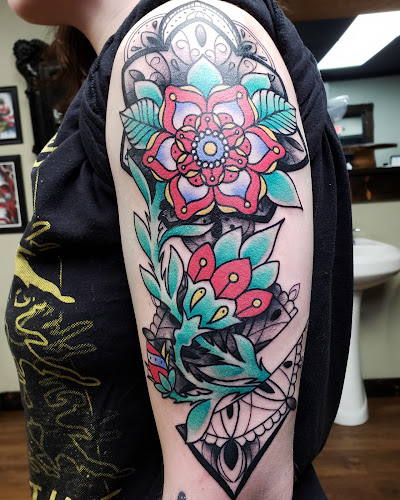 Work by Couture Tattoo and Body Piercing