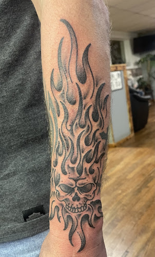 Work by Iron Moon Tattoo llc