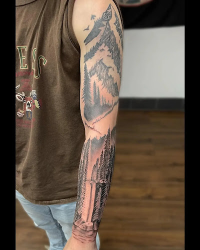 Work by Laughing Koffin Tattoo