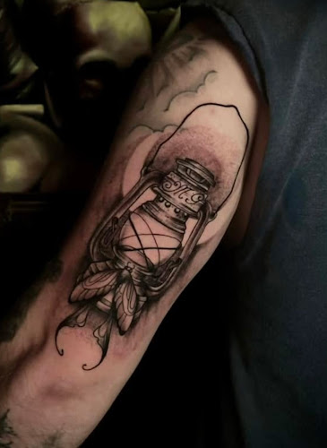 Work by Moth to Flame Tattoo Studio
