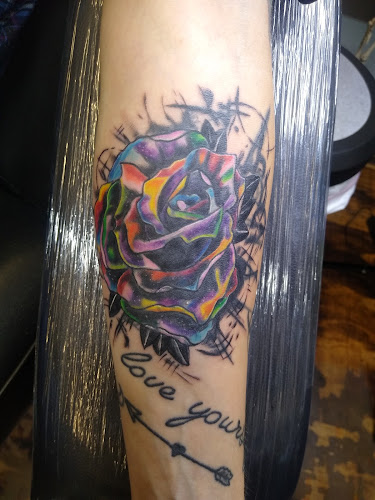 Work by Anchored Arms Custom Tattoo