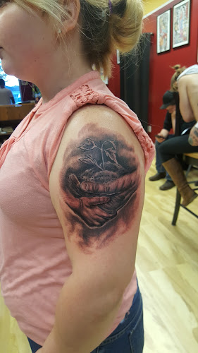 Work by Iron Buddha Tattoo Studio