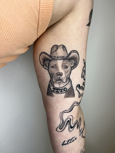 Work by Under the Gun Tattoo Studio