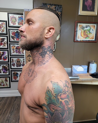 Work by Arsenal Tattoo Co