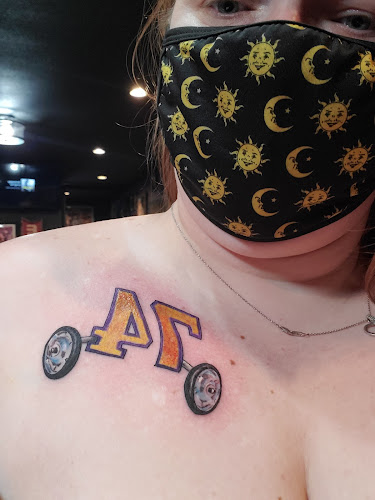 Work by Dubuque Tattoo Club LLC.
