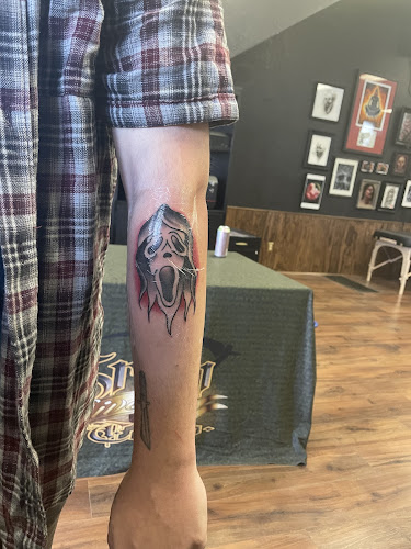Work by Grim River Tattoo