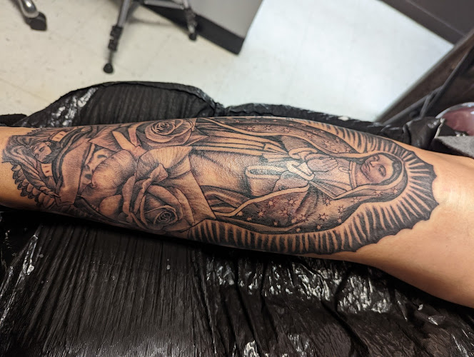 Work by Wyze Guyz Tattoo Parlor