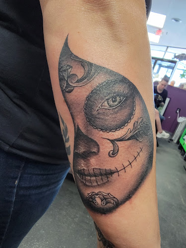 Work by Disconnected Tattoo and Art Co.