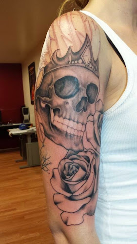 Work by Lions Paw Tattoo