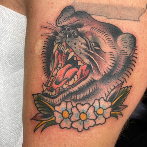 Work by Cardinal Quill Tattoo