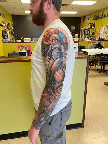 Work by Gilded Heron Tattoo