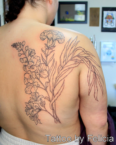 Work by Tiger Lotus Tattoo and Piercing