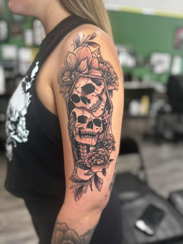 Work by A Mom N Pop Tattoo Shop