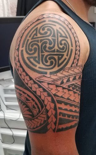 Work by Snakeman's Tattoos, Piercings & Leather