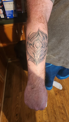 Work by Slack Tide Tattoo Company