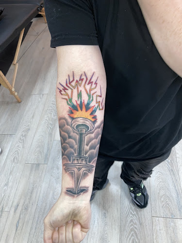 Work by The Gold Tooth Grin Tattoo Company