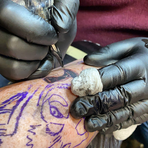 Work by Anchors Aweigh Tattoo Company