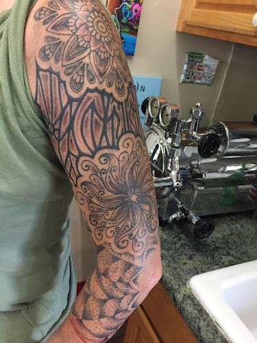 Work by Grasshopper Tattoo Studio