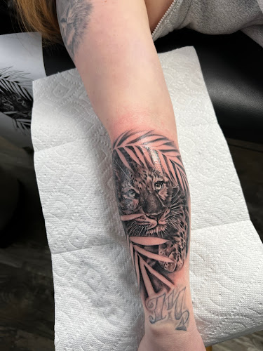 Work by Grit And Stone Tattoo
