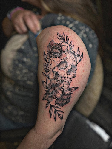Work by Moth & Flame Tattoo Parlor
