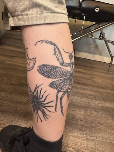 Work by Squid Ink Tattoo and Art Gallery