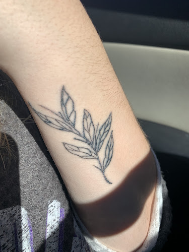Work by Painted Lady Tattoos and Piercing