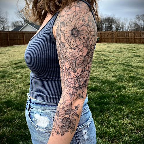 Work by Draw The Line Tattoo Club