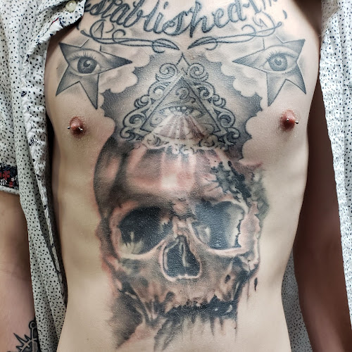 Work by 22 Caliber Tattoo Mega Studio