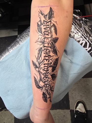 Work by Iron Lily Tattoo & Piercing Studio