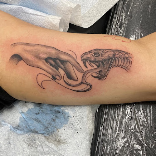 Work by Atomic Tattoo & Body Piercing