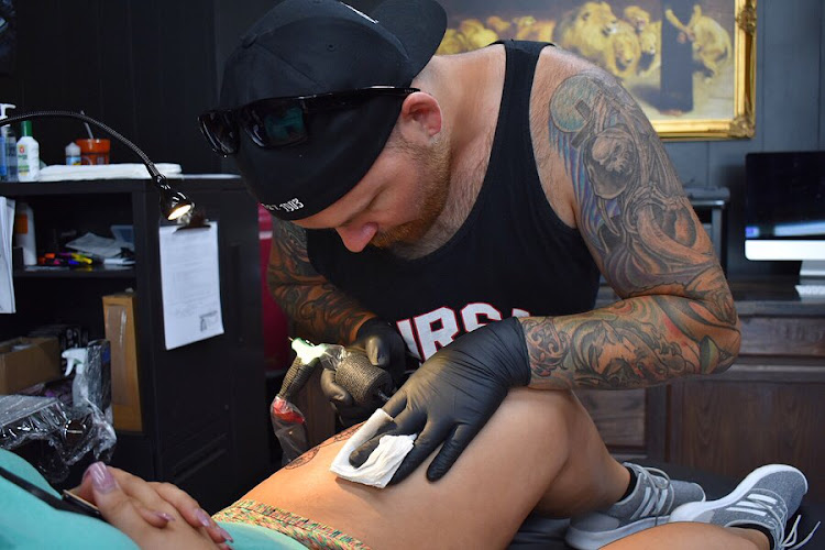 Work by 33 Lions Tattoo