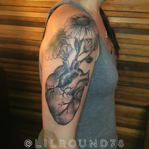 Work by Tattoos by Lil Round