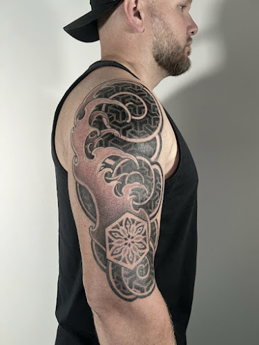Work by Symbiosis Tattoos
