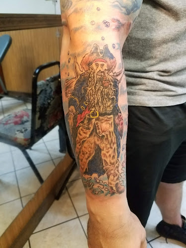 Work by Screaming Needle Tattoo & Body Piercing